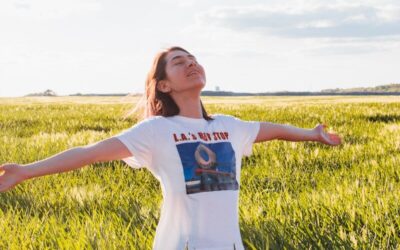 woman standing in green field